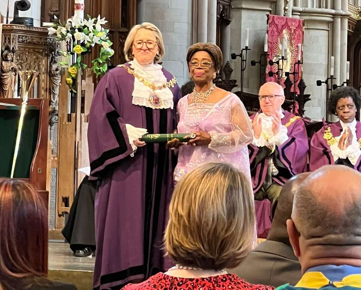 Foster carer Henrietta Onyema gets the award from Cllr Catherine Rose